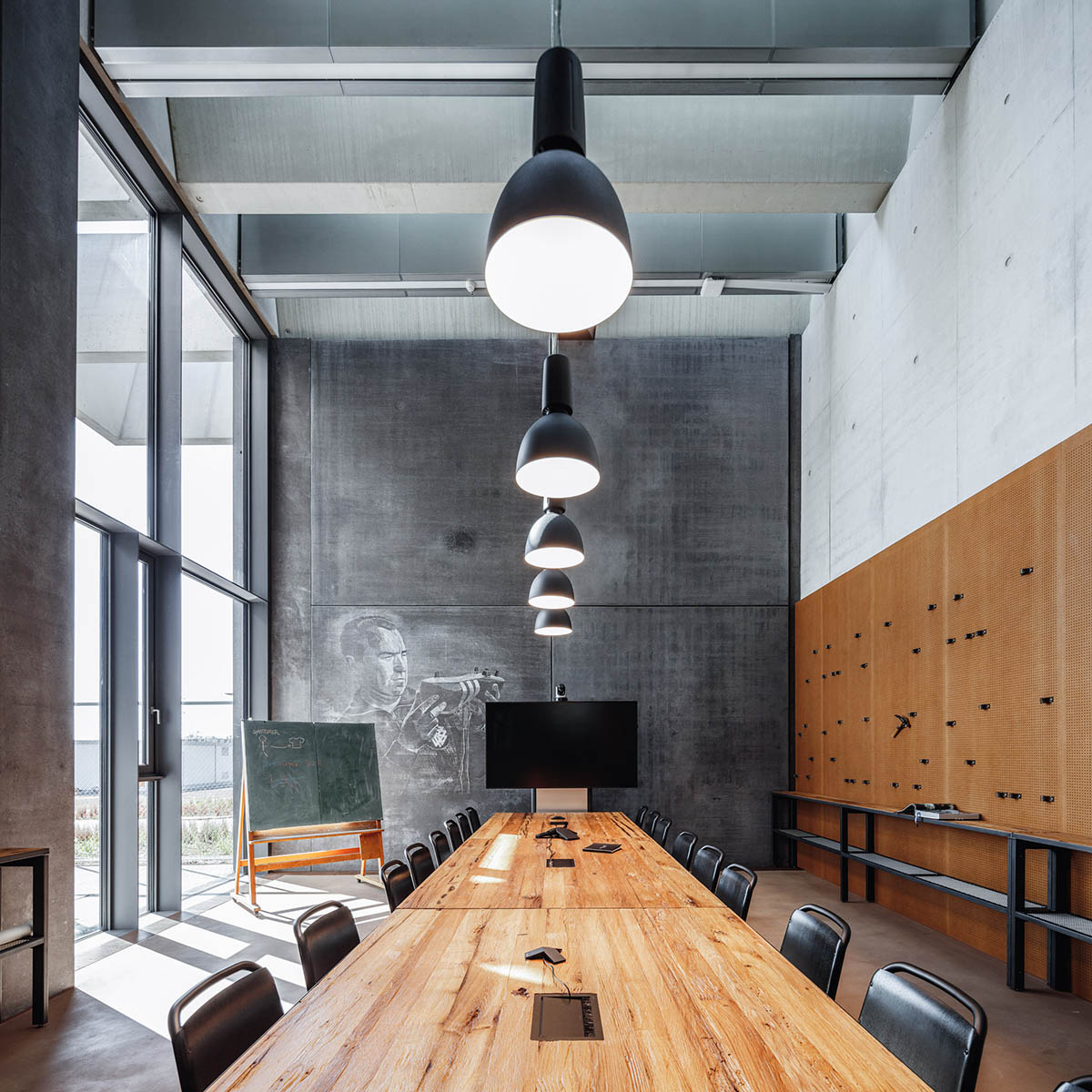 COBE creates giant rhomboid roof for Adidas' new headquarters in Germany