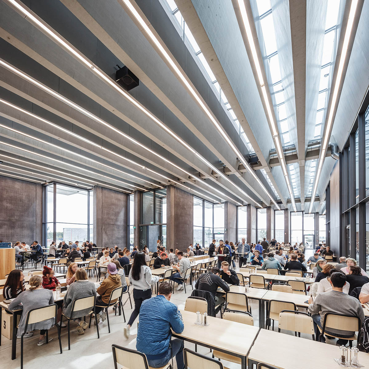 COBE creates giant rhomboid roof for Adidas' new headquarters in Germany