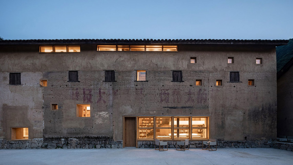 Atelier tao+c converts old building into capsule hotel with corrugated polycarbonate panels in China