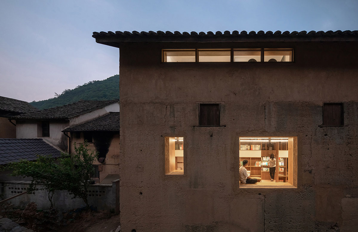 Atelier tao+c converts old building into capsule hotel with corrugated polycarbonate panels in China