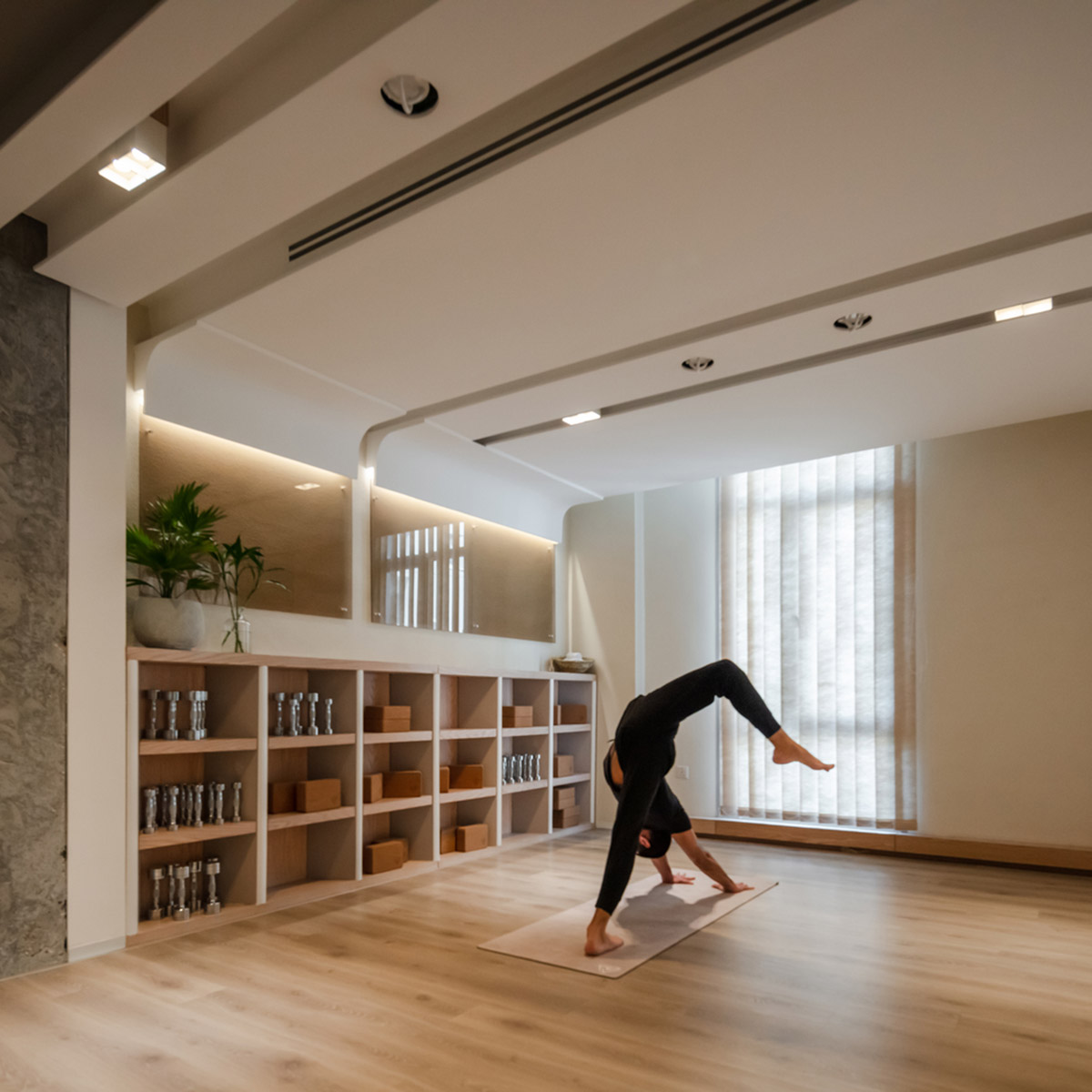 Minimal and rich color palette embrace diversity in this interior for a yoga studio in Kuwait