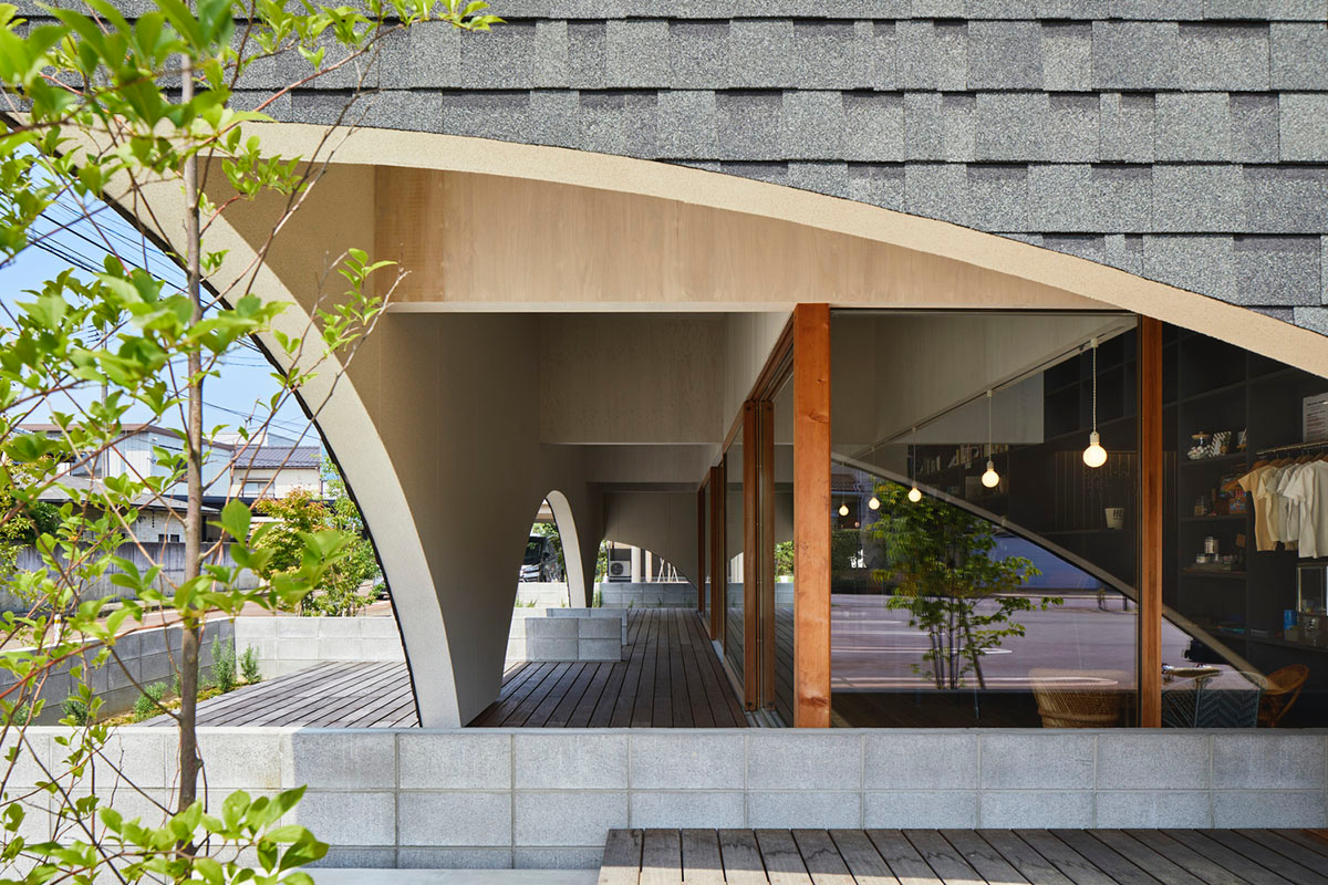 A dental clinic and daycare center are hidden under arches in Japan by Takeru Shoji Architects