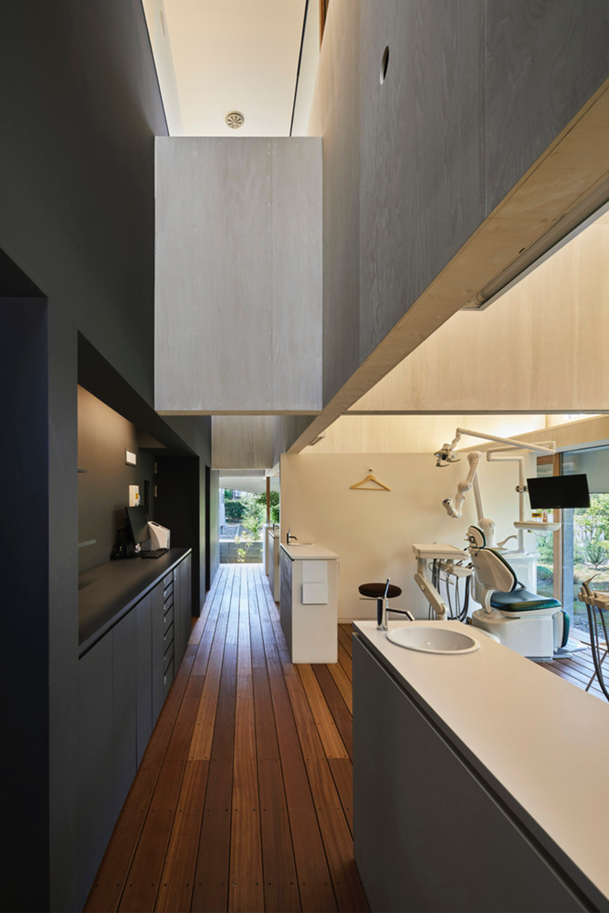 A dental clinic and daycare center are hidden under arches in Japan by Takeru Shoji Architects