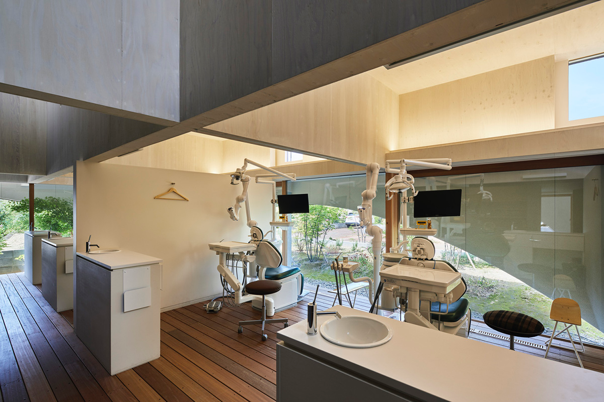 A dental clinic and daycare center are hidden under arches in Japan by Takeru Shoji Architects