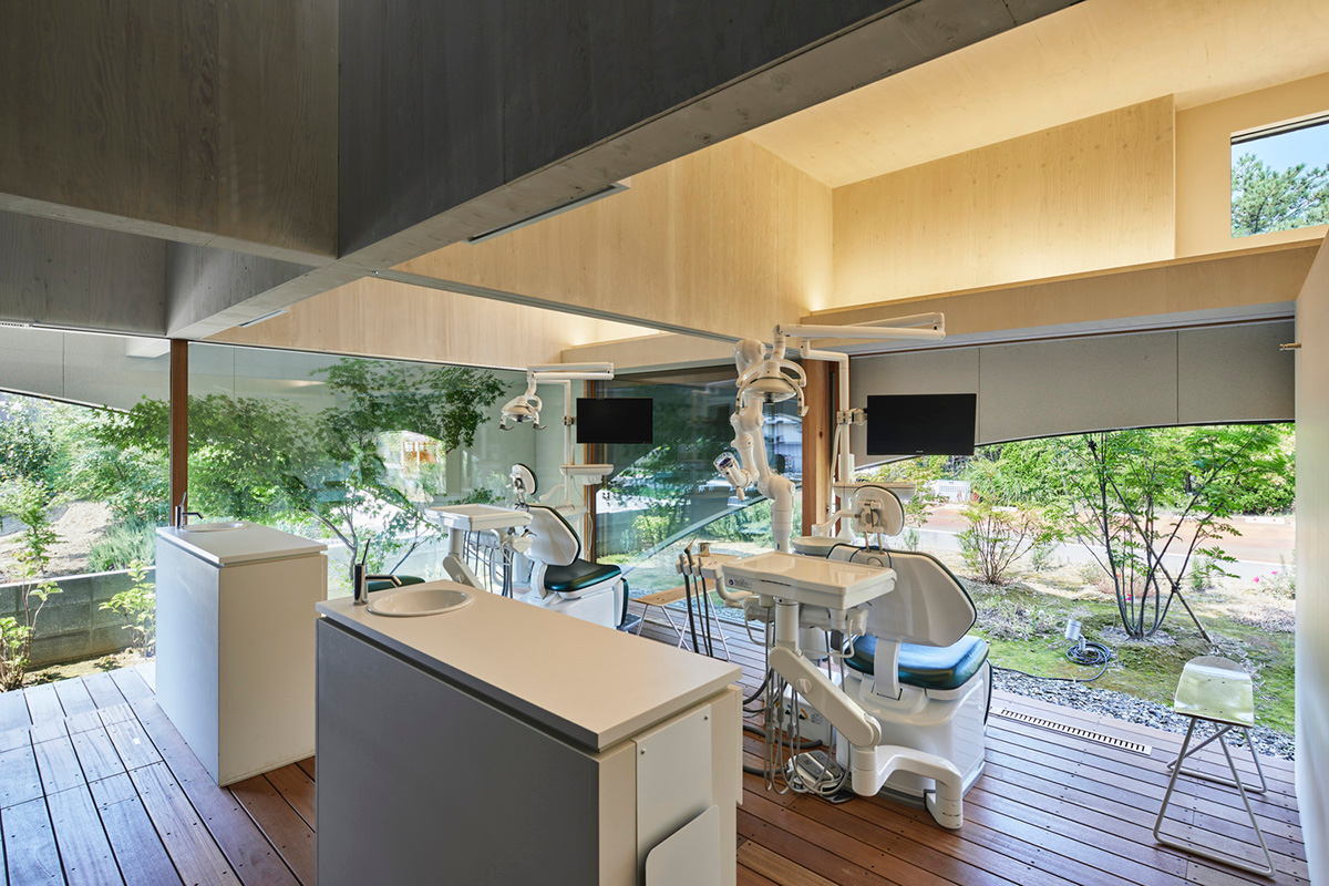 A dental clinic and daycare center are hidden under arches in Japan by Takeru Shoji Architects