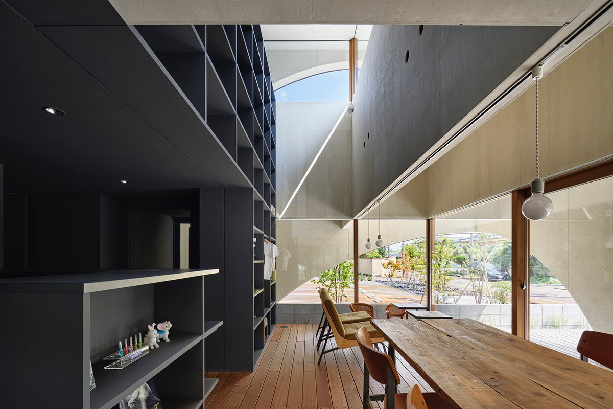 A dental clinic and daycare center are hidden under arches in Japan by Takeru Shoji Architects