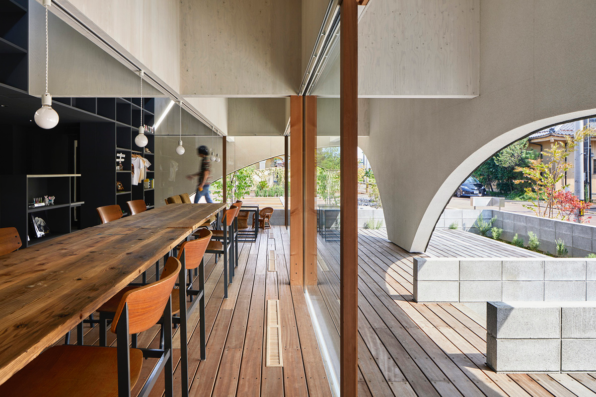 A dental clinic and daycare center are hidden under arches in Japan by Takeru Shoji Architects