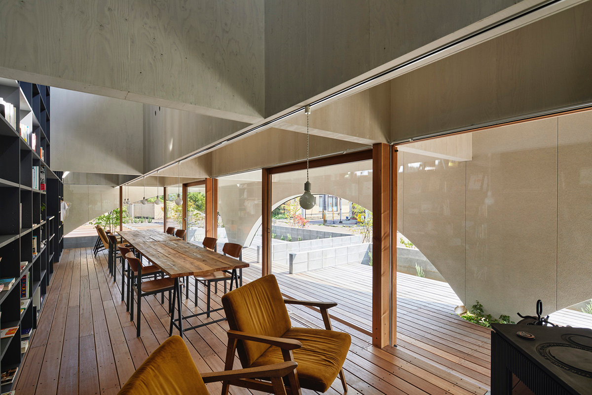 A dental clinic and daycare center are hidden under arches in Japan by Takeru Shoji Architects