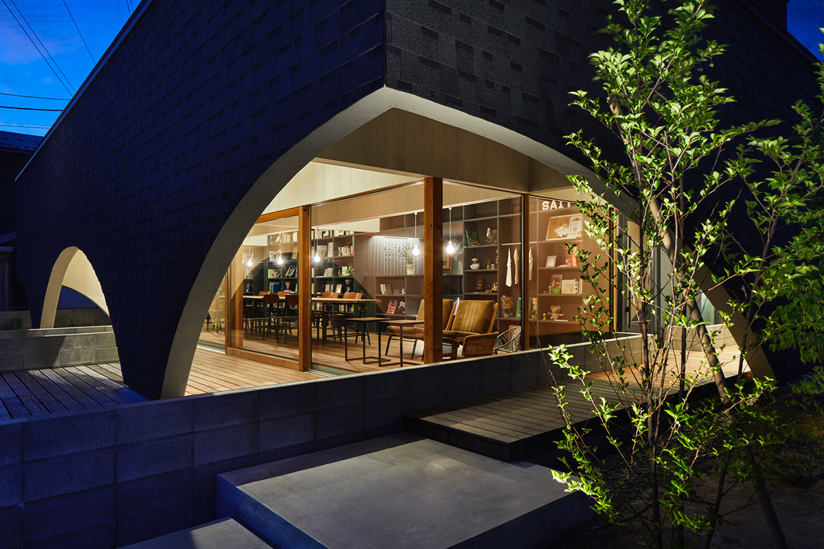 A dental clinic and daycare center are hidden under arches in Japan by Takeru Shoji Architects