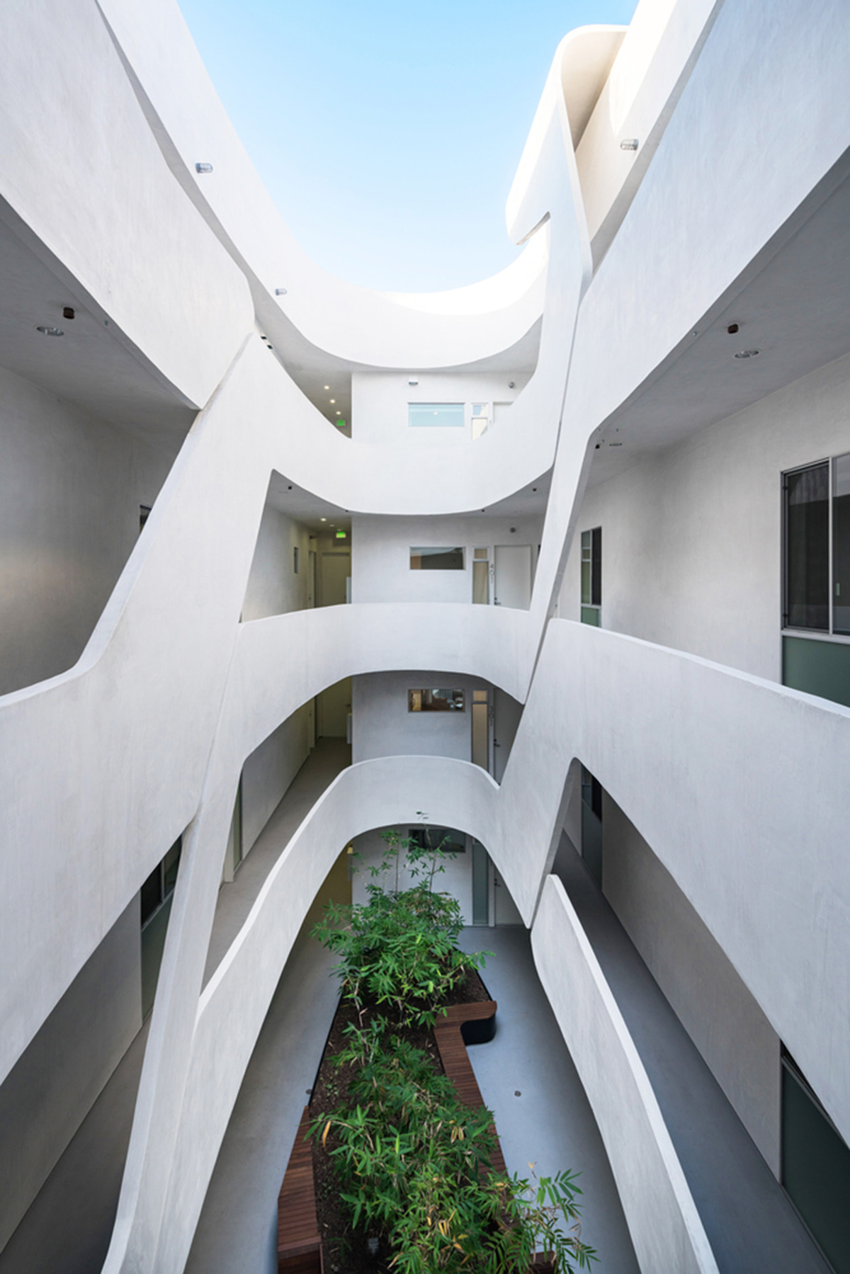 LOHA slightly pushes four sides of this apartment inward to adapt to its tight plot in Los Angeles