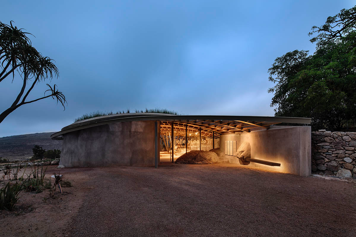 KLG Architects completes heritage center with undulating roof that acts as a small shelter