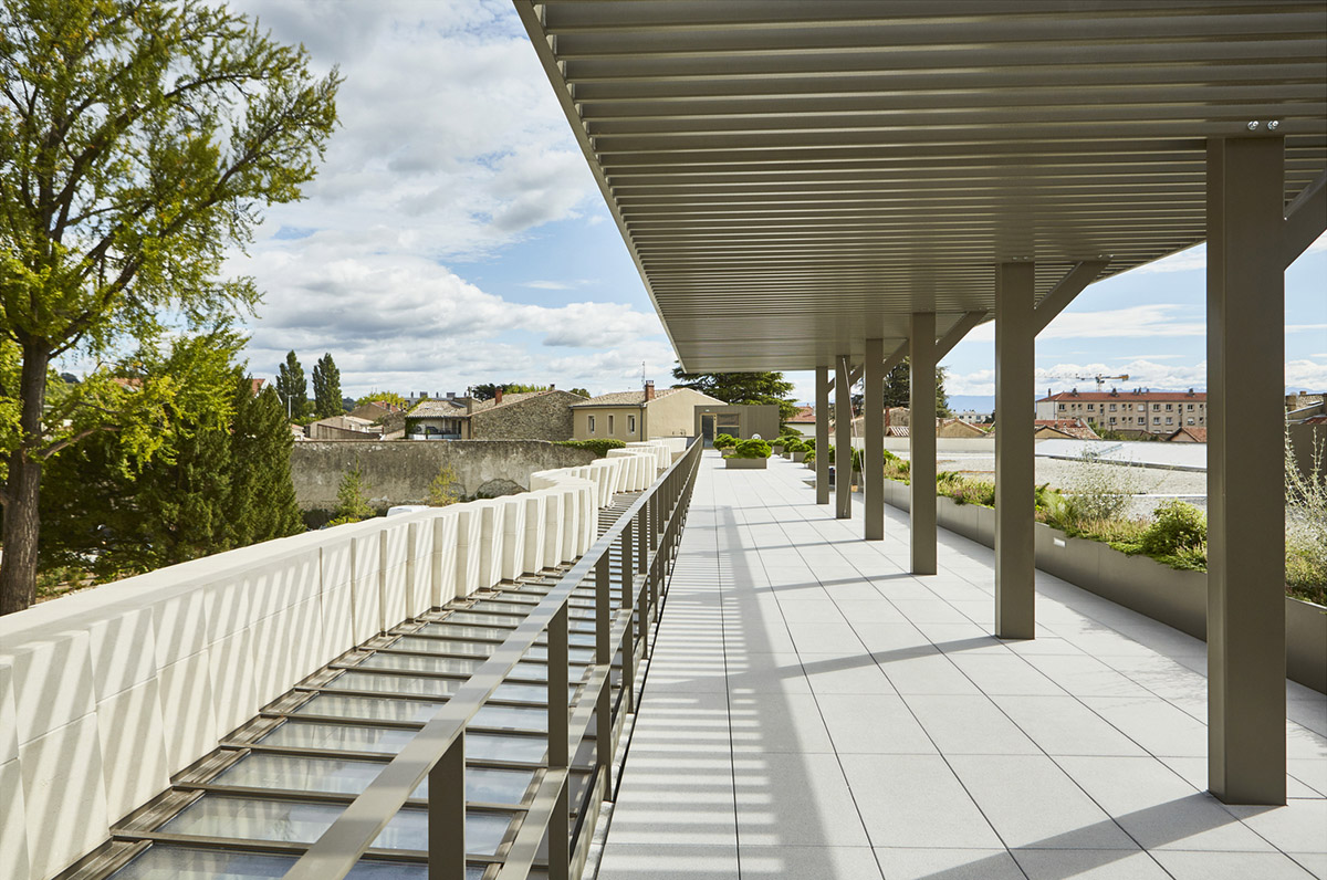 Curving stone solid walls form this winery and guide visitors for winemaking process in France