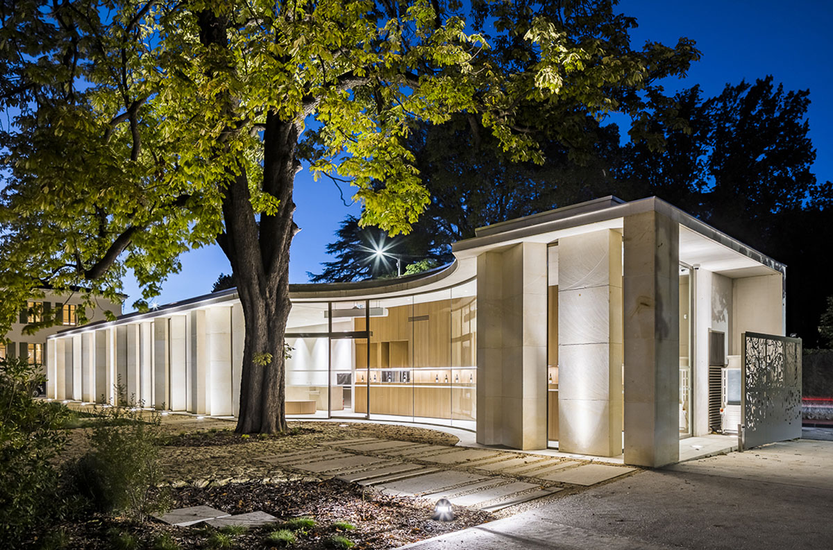Curving stone solid walls form this winery and guide visitors for winemaking process in France