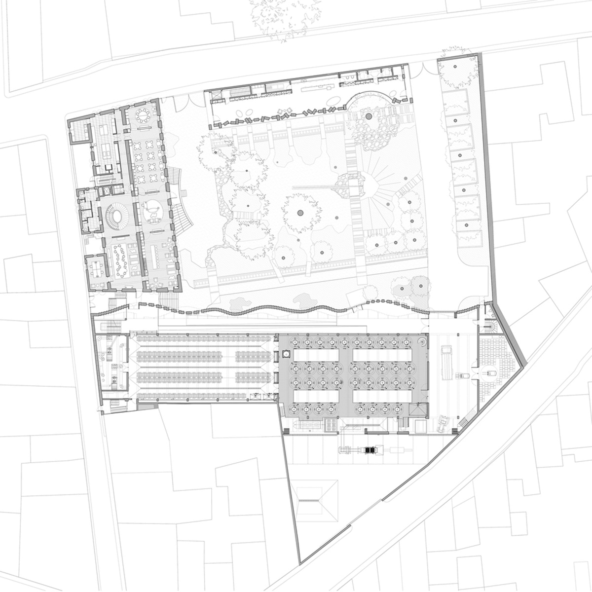 Curving stone solid walls form this winery and guide visitors for winemaking process in France