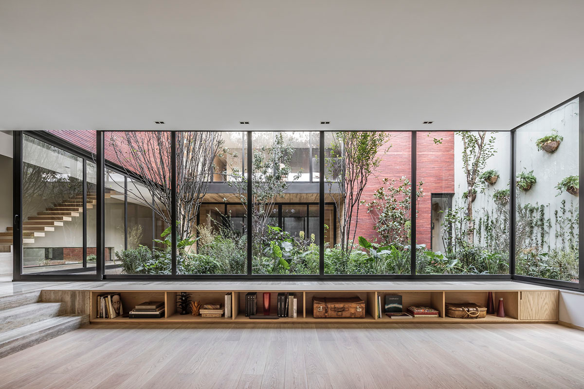 ESRAWE designs house by using red brick pavilion-like volumes in Mexico City