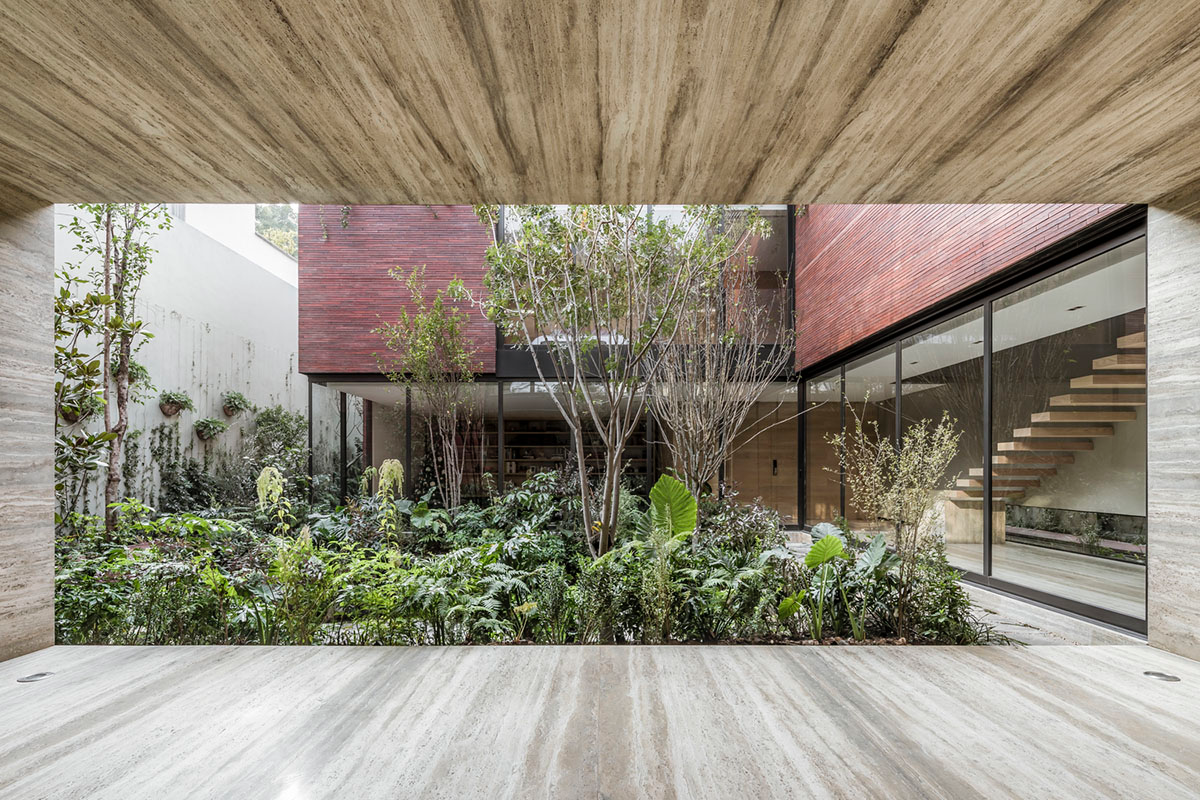 ESRAWE designs house by using red brick pavilion-like volumes in Mexico City