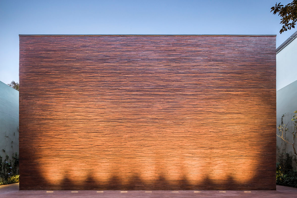 ESRAWE designs house by using red brick pavilion-like volumes in Mexico City