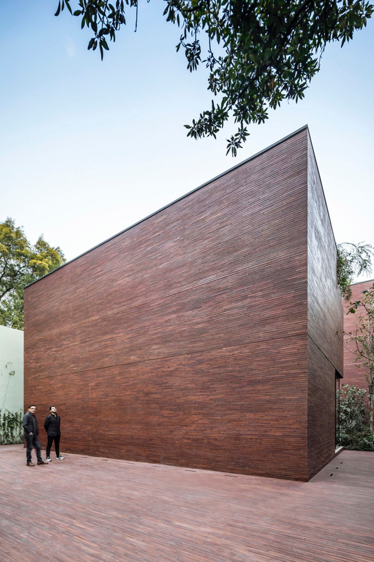 ESRAWE designs house by using red brick pavilion-like volumes in Mexico City