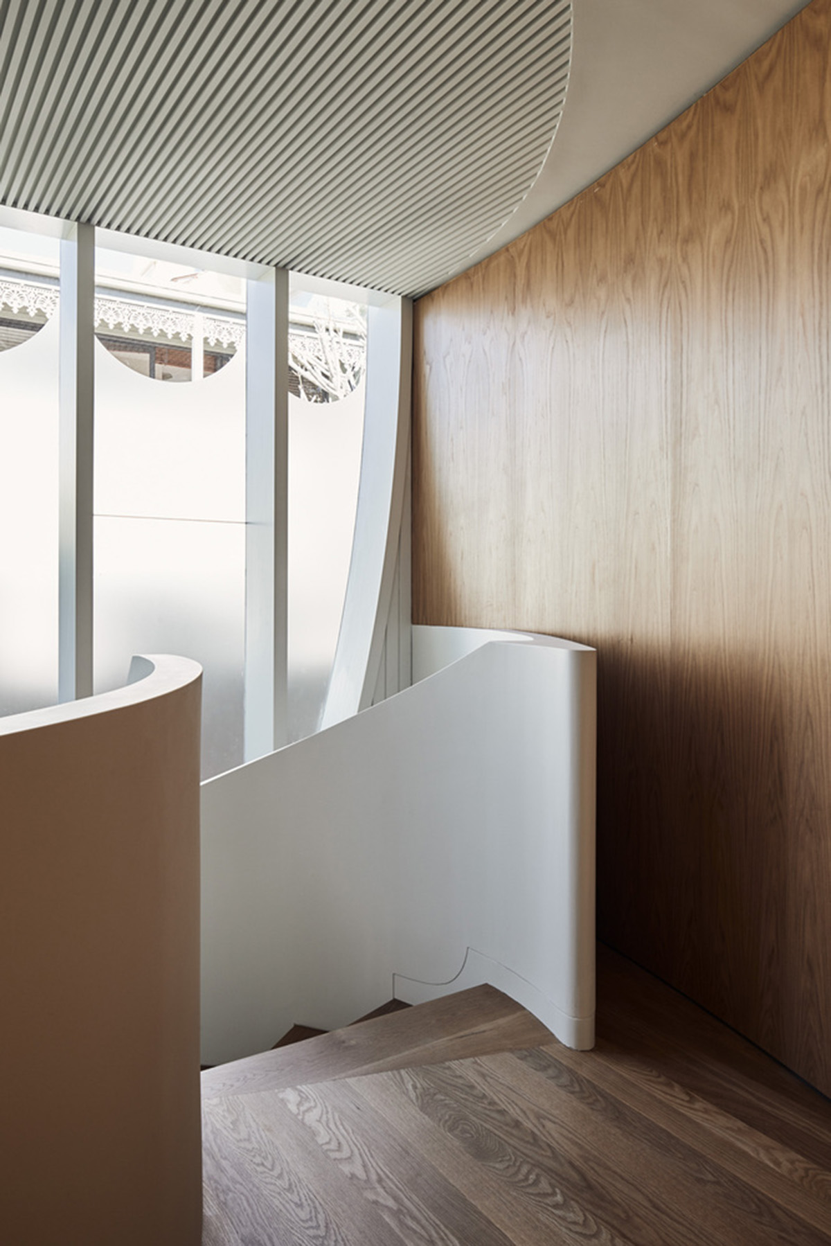 Chenchow Little Architects creates arched cut-outs for residence referencing to old Victorian houses