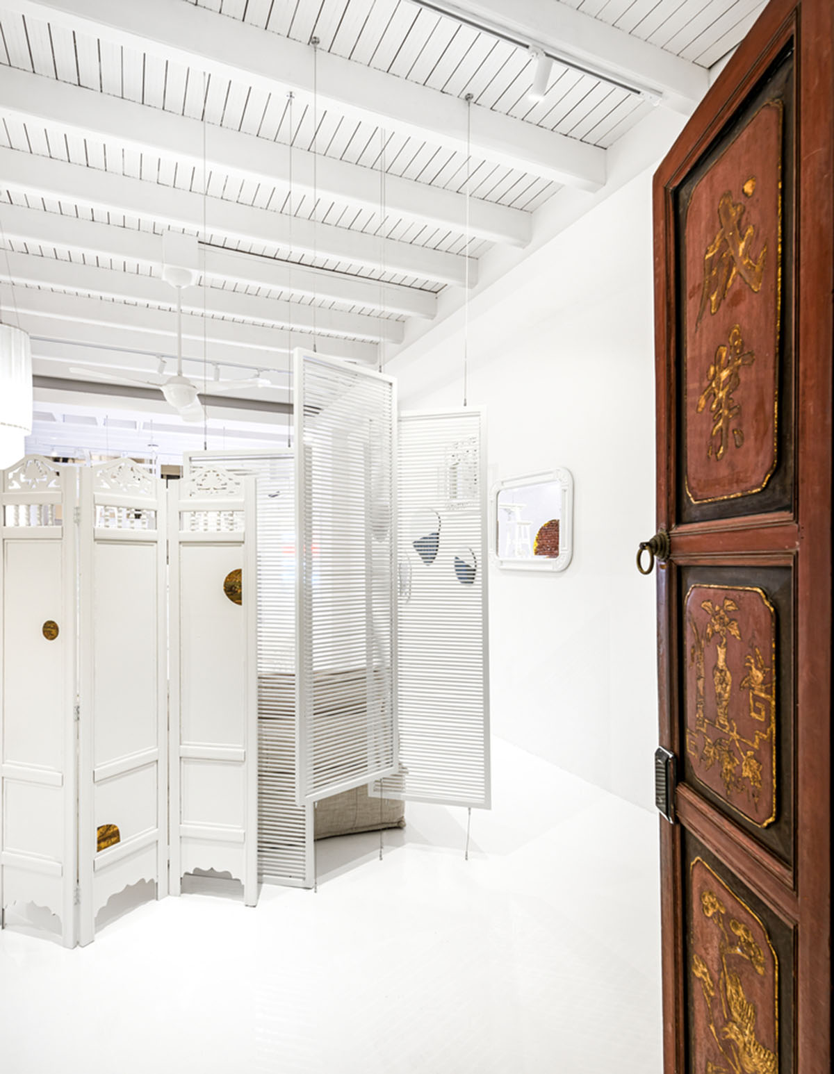 Ministry of Design transforms old dwelling in Singapore into co-living house with all-white interiors