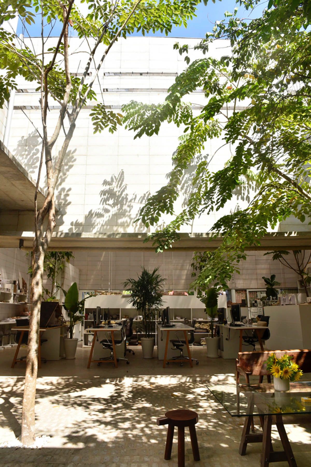 An office in Vietnam protects its own micro-climate with continuous spaces and internal courtyards