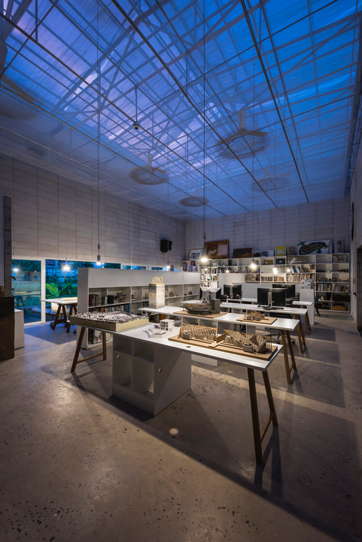 An office in Vietnam protects its own micro-climate with continuous spaces and internal courtyards