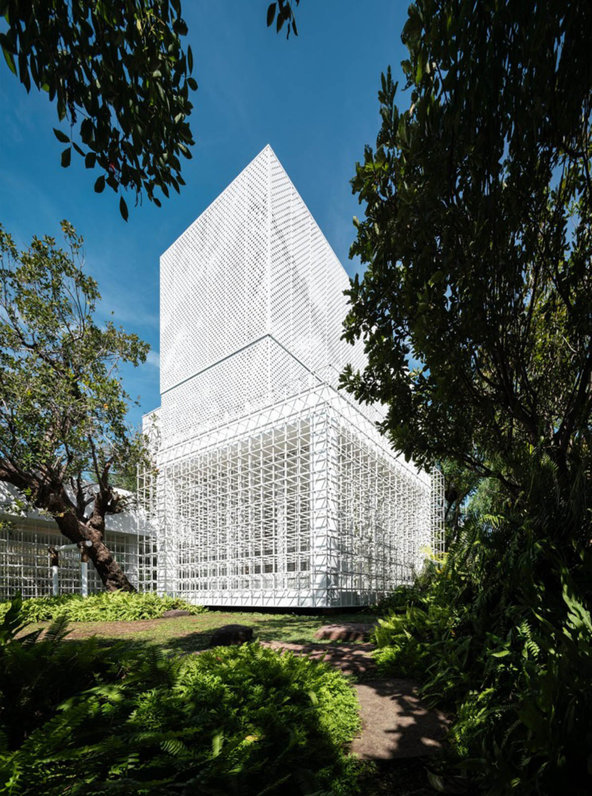 AAd built self-sustainable residence with perforated facade and steel rods in Thailand