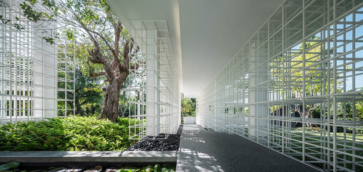 AAd built self-sustainable residence with perforated facade and steel rods in Thailand