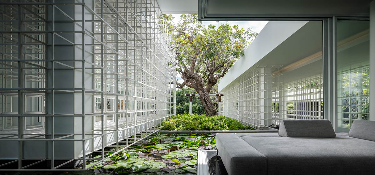 AAd built self-sustainable residence with perforated facade and steel rods in Thailand