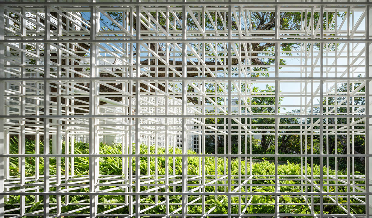 AAd built self-sustainable residence with perforated facade and steel rods in Thailand