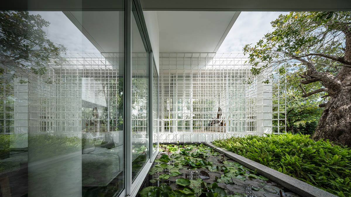 AAd built self-sustainable residence with perforated facade and steel rods in Thailand