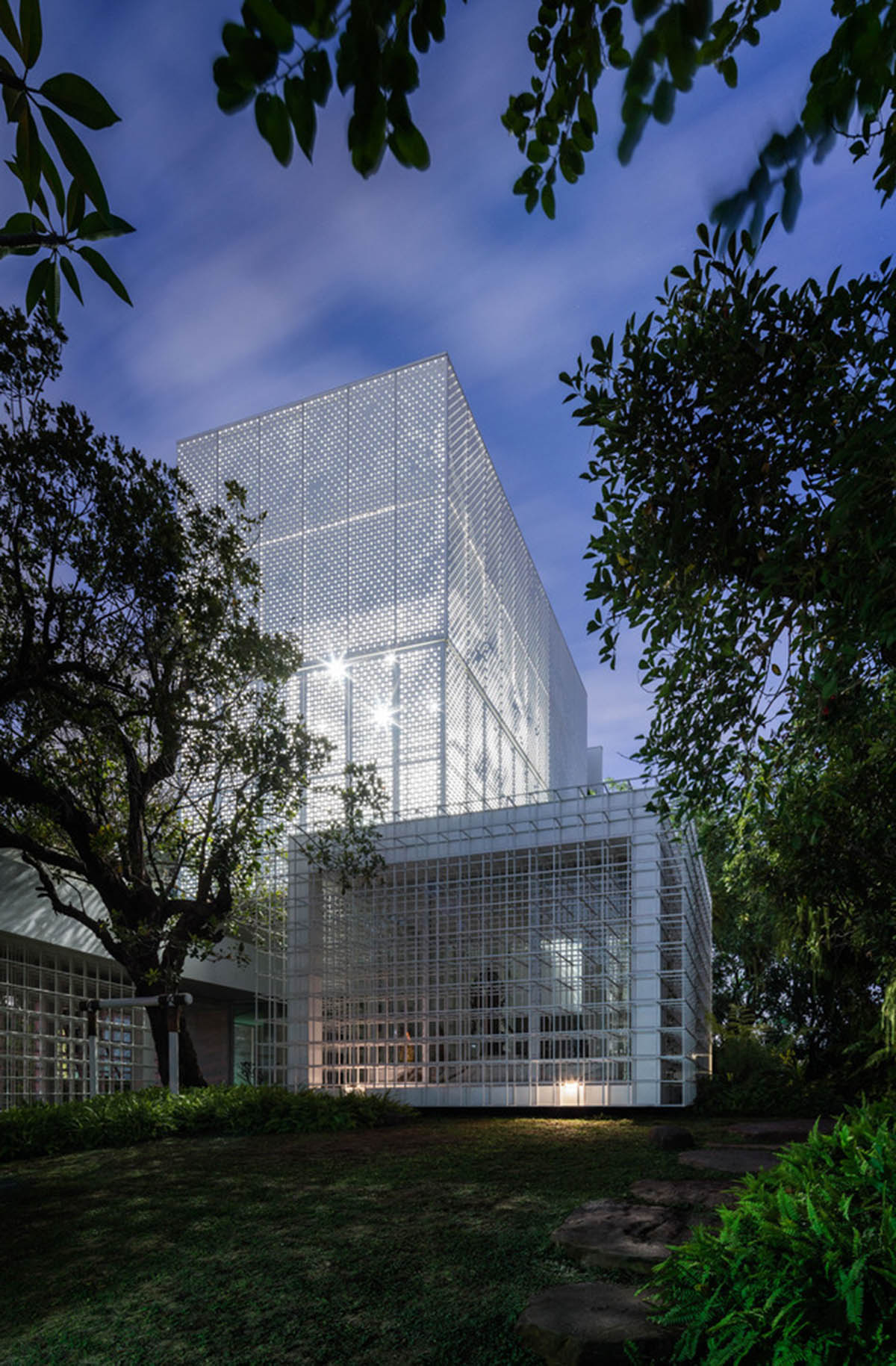 AAd built self-sustainable residence with perforated facade and steel rods in Thailand