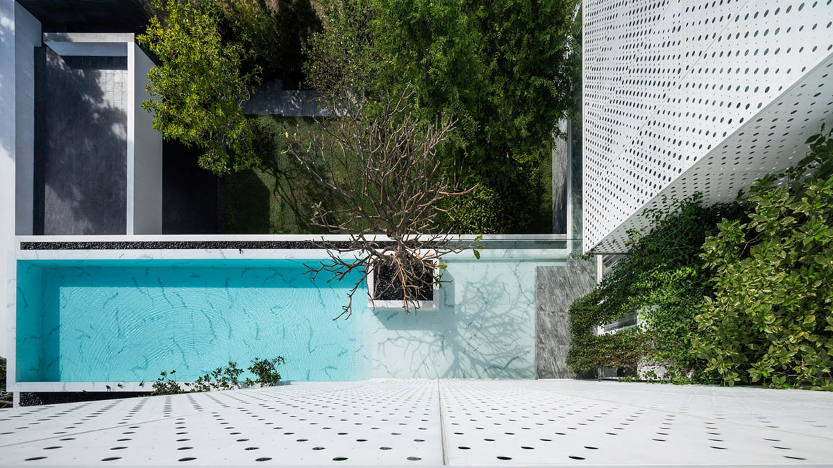 AAd built self-sustainable residence with perforated facade and steel rods in Thailand