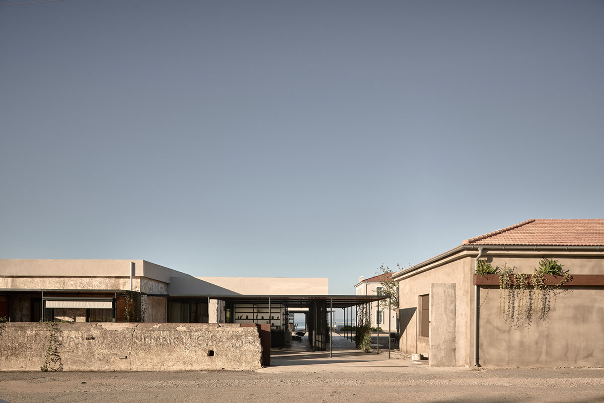 K-Studio converts historic winery complex into industrial-looking seaside hotel in Kourouta, Greece
