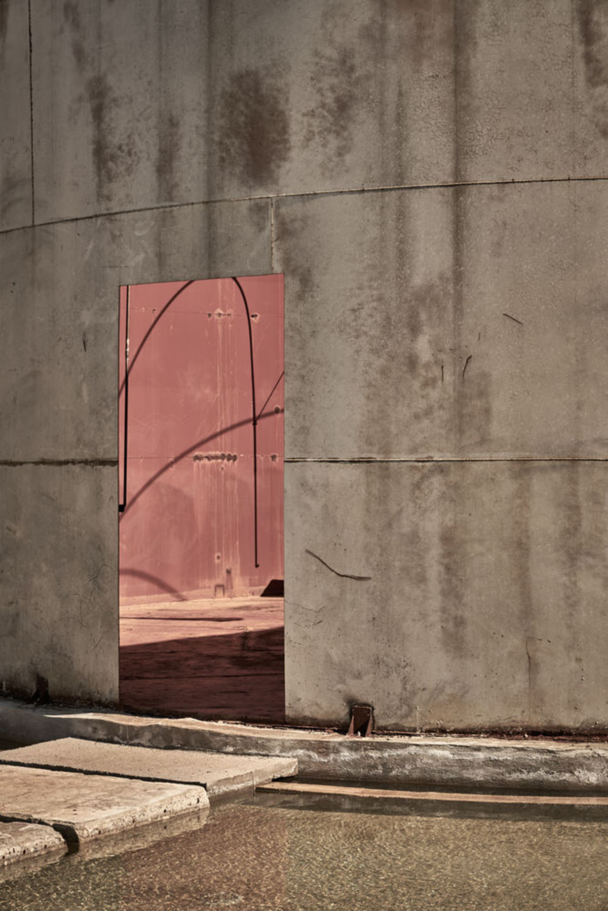 K-Studio converts historic winery complex into industrial-looking seaside hotel in Kourouta, Greece