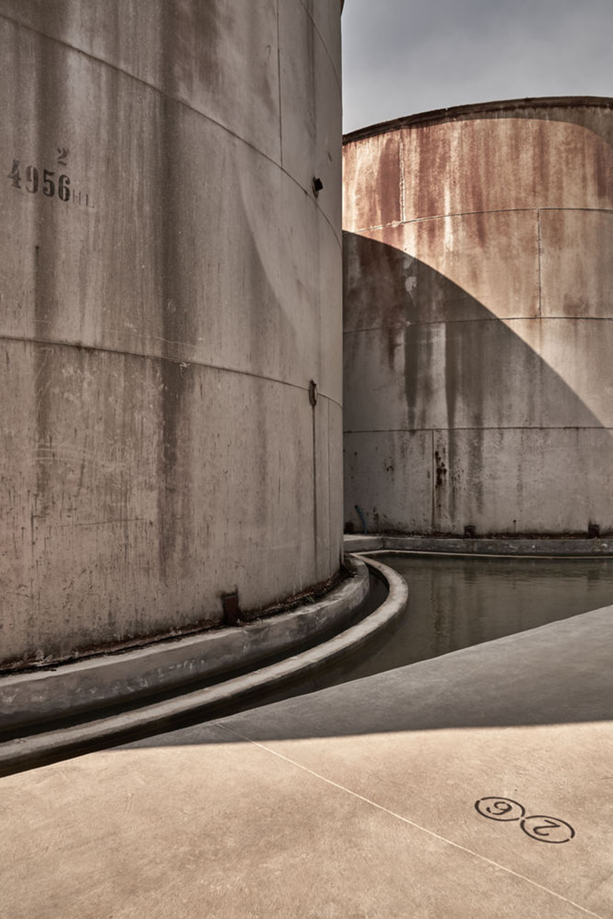 K-Studio converts historic winery complex into industrial-looking seaside hotel in Kourouta, Greece