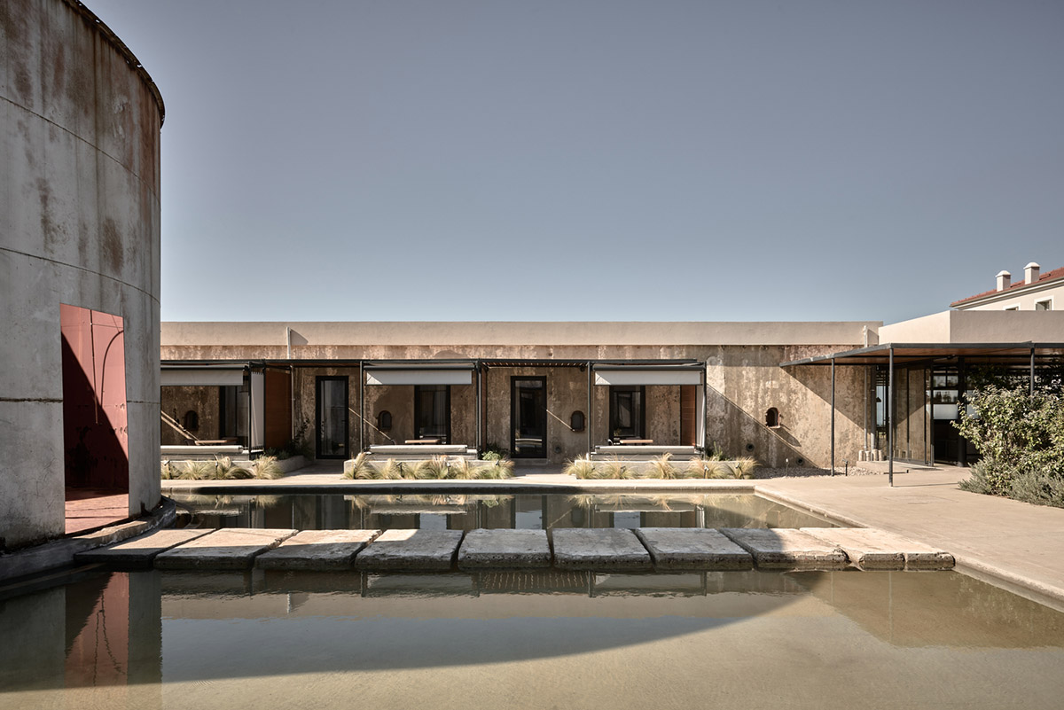 K-Studio converts historic winery complex into industrial-looking seaside hotel in Kourouta, Greece