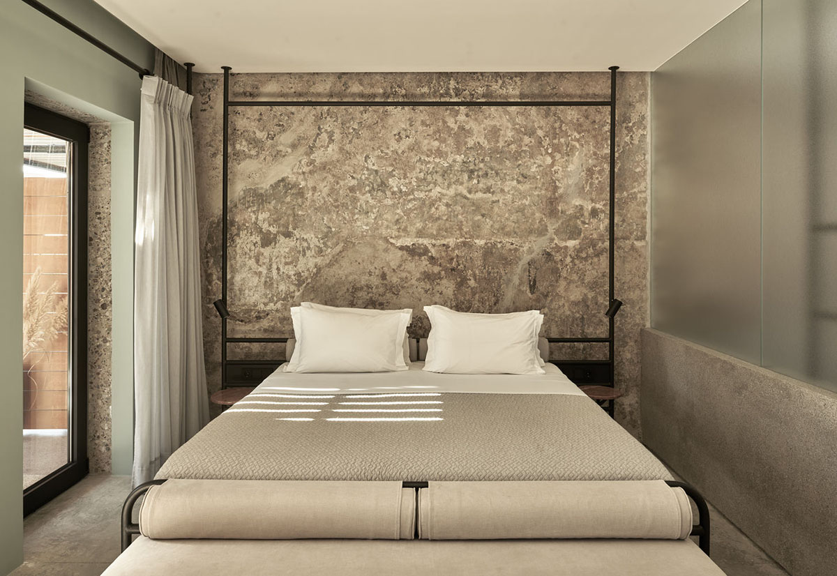 K-Studio converts historic winery complex into industrial-looking seaside hotel in Kourouta, Greece