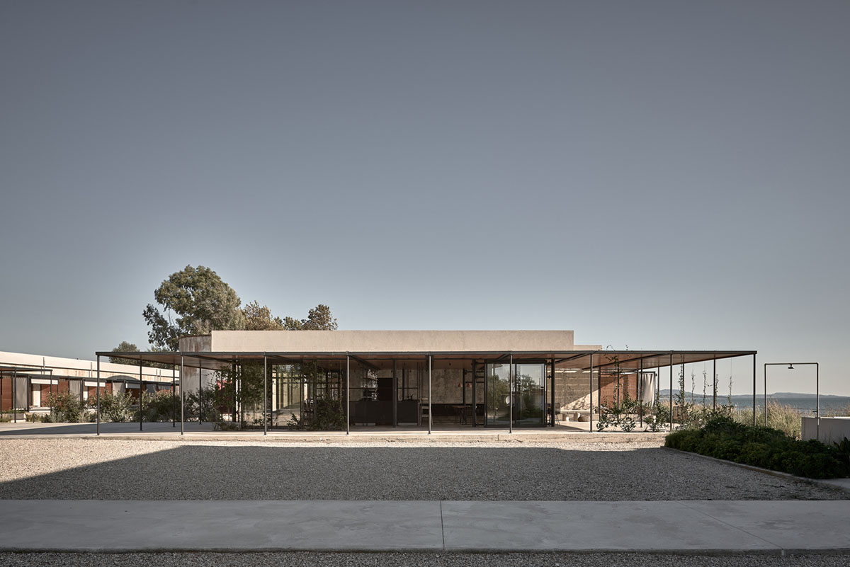 K-Studio converts historic winery complex into industrial-looking seaside hotel in Kourouta, Greece