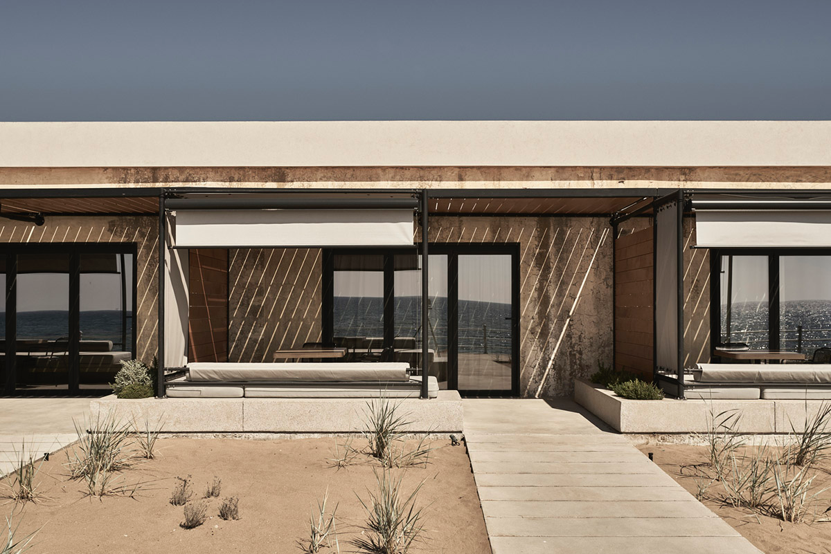 K-Studio converts historic winery complex into industrial-looking seaside hotel in Kourouta, Greece