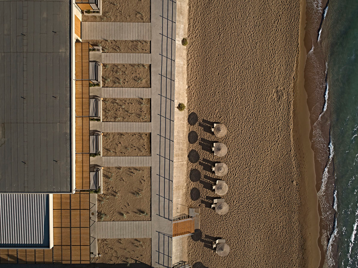 K-Studio converts historic winery complex into industrial-looking seaside hotel in Kourouta, Greece