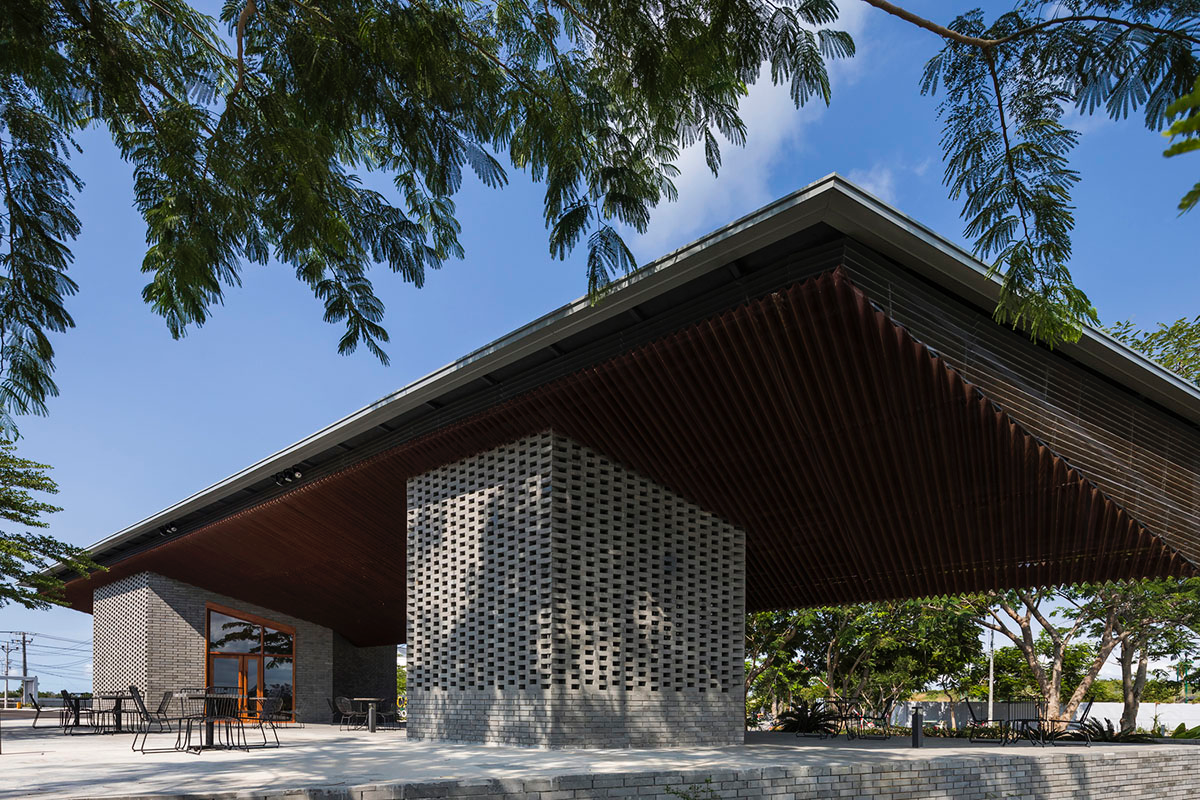 Hexagonal pavilions are hidden under V-shaped roofs that look like a pair of bird wings in Vietnam