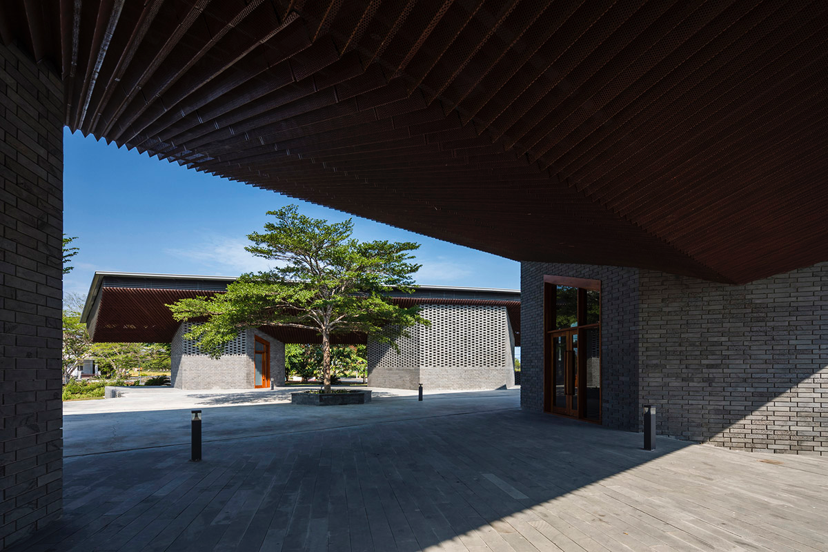 Hexagonal pavilions are hidden under V-shaped roofs that look like a pair of bird wings in Vietnam