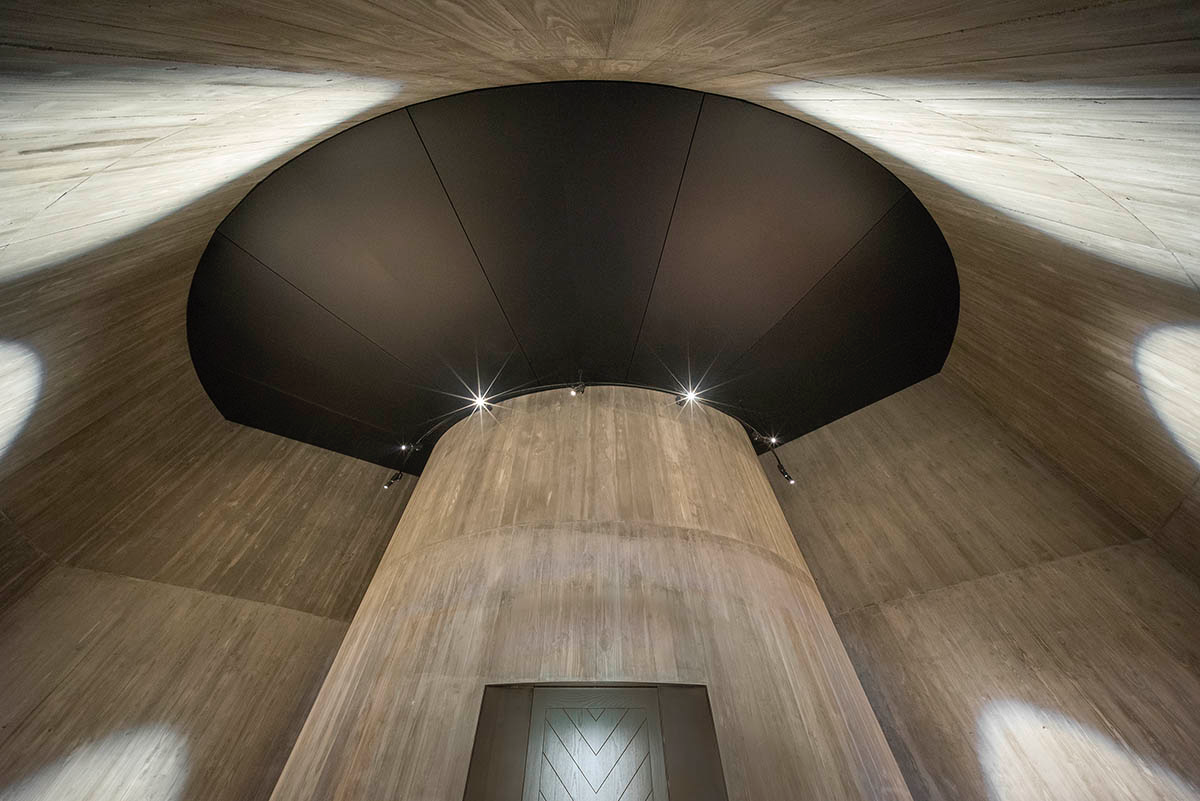 Wood Marsh built sculptural Towers Road House that features disc-shaped zinc roof in Toorak