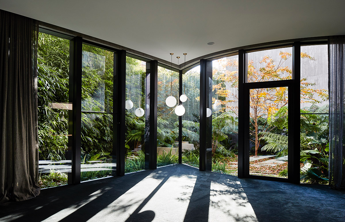 Wood Marsh built sculptural Towers Road House that features disc-shaped zinc roof in Toorak