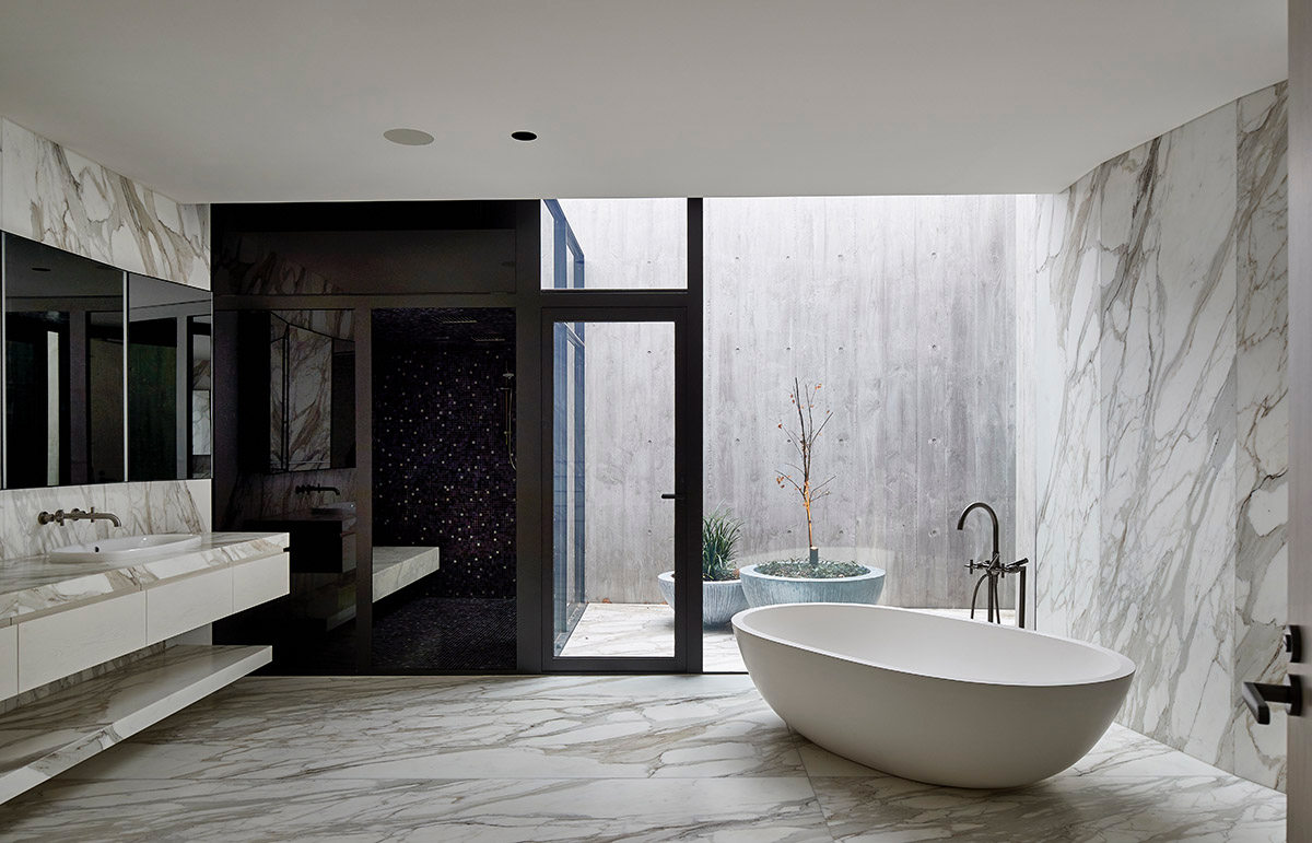 Wood Marsh built sculptural Towers Road House that features disc-shaped zinc roof in Toorak