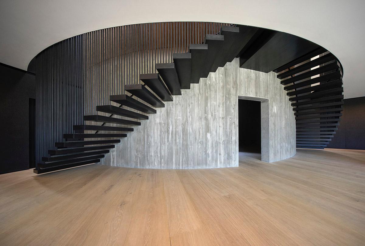 Wood Marsh built sculptural Towers Road House that features disc-shaped zinc roof in Toorak