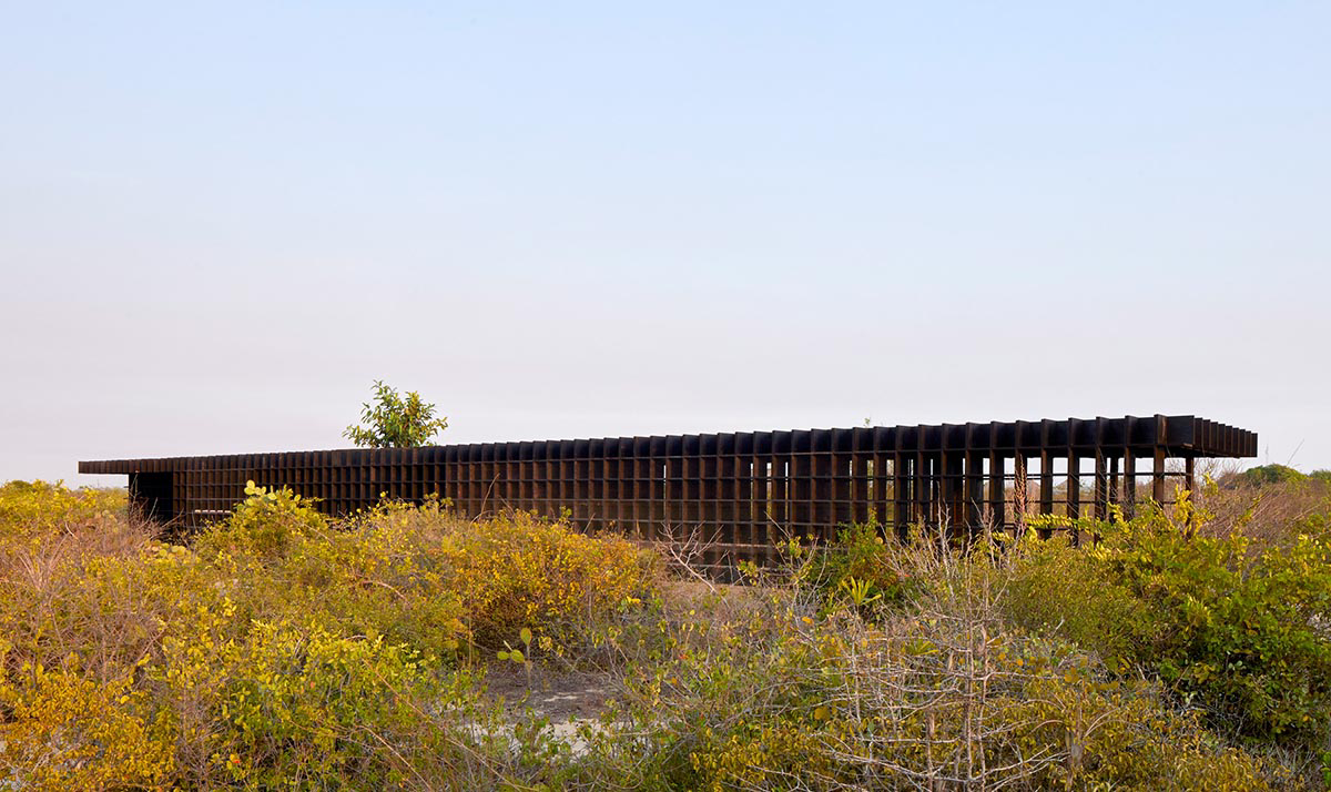 Kengo Kuma and Associates built chicken coop made of burnt wooden boards in Mexico