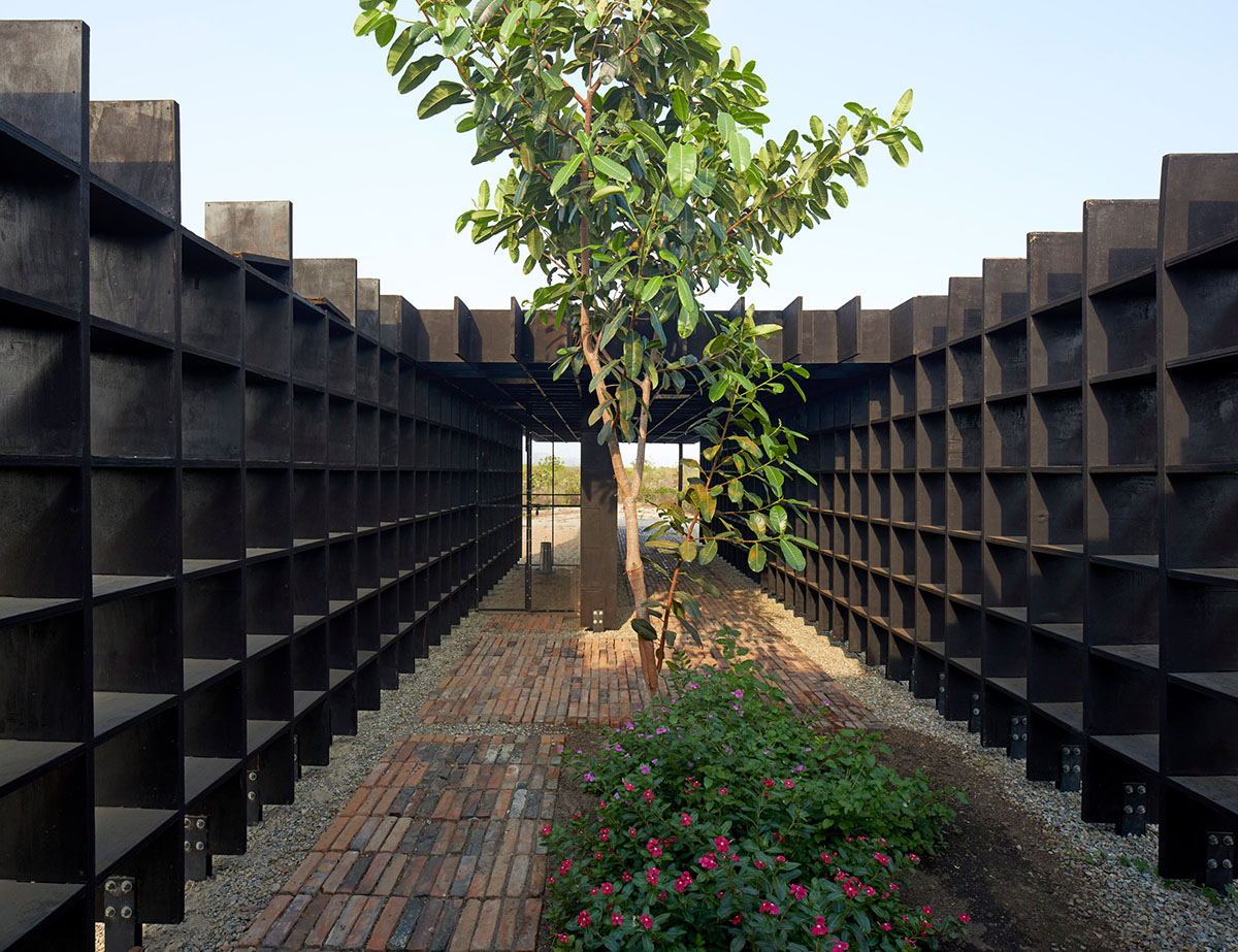 Kengo Kuma and Associates built chicken coop made of burnt wooden boards in Mexico