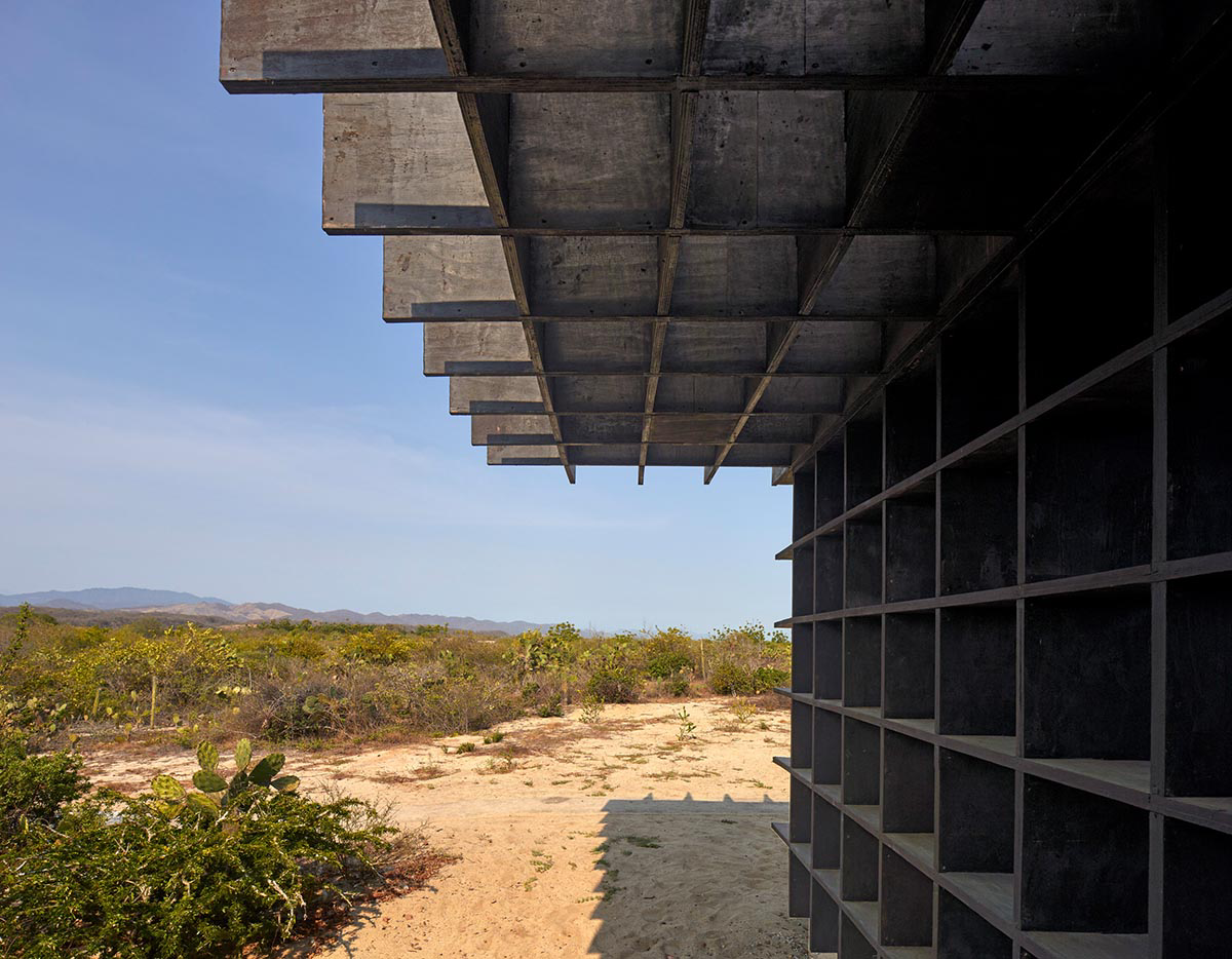 Kengo Kuma and Associates built chicken coop made of burnt wooden boards in Mexico